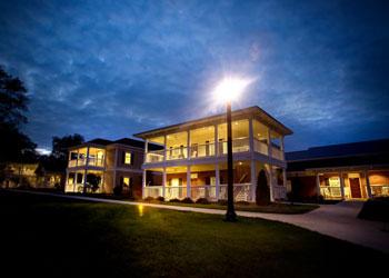 twilight view of a lit campus building