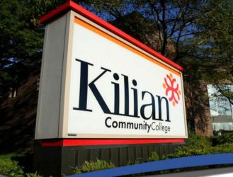 sign 'Kilian Community College' with logo