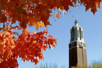 bell tower framed by autumn leaves