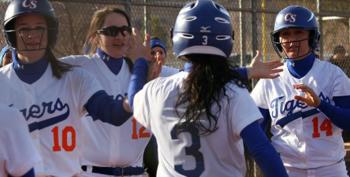 softball team celebrating with high fives