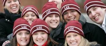 group of people in matching hats smiling