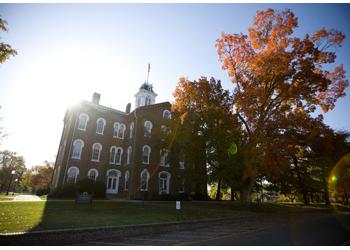 historic building with a clock tower in autumn