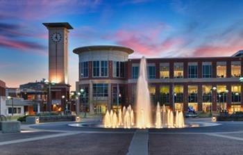 modern building with fountain and twilight sky