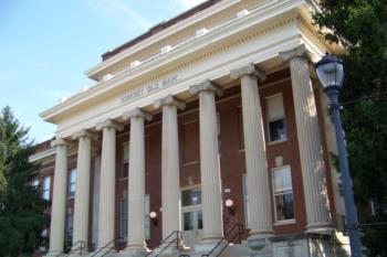 front of a building with columns and steps