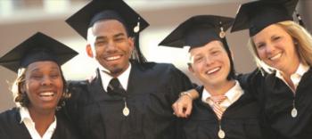 graduates in caps and gowns laughing together