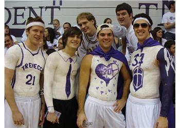 group of students in painted shirts at a sports event