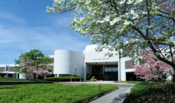 campus building with flowering trees