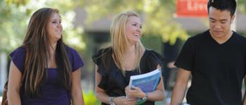 three students walking and talking