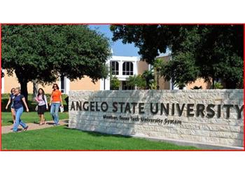 students walking past angelo state university sign