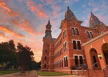 historic building at dusk with colorful sky