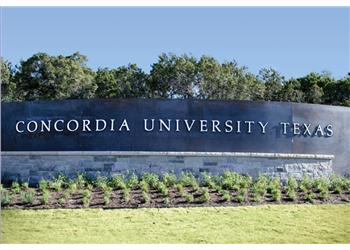 concordia university texas sign on stone wall