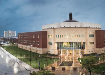 exterior of circular modern building after rain