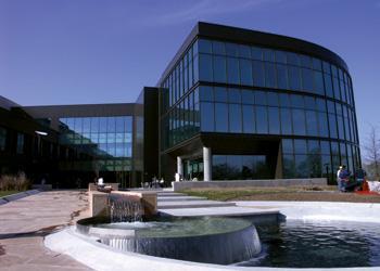 modern campus building with a water feature