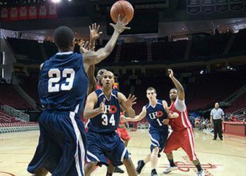 basketball game in action with UHD branding