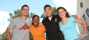 four students smiling