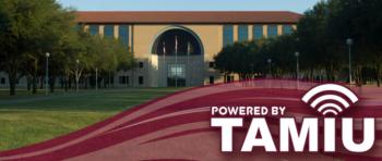 arched building entrance with 'powered by TAMIU' logo