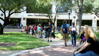 students walking outside campus building