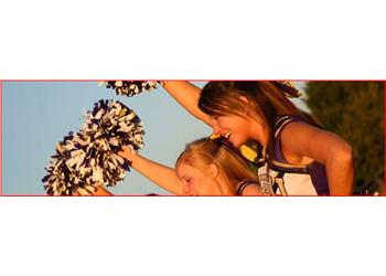 cheerleaders with pompoms at golden hour