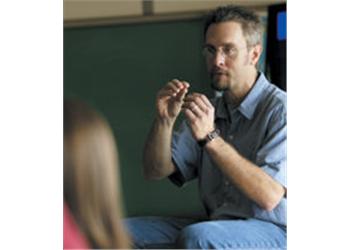 a professor gesturing during a lecture