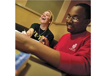 students laughing together in a study session