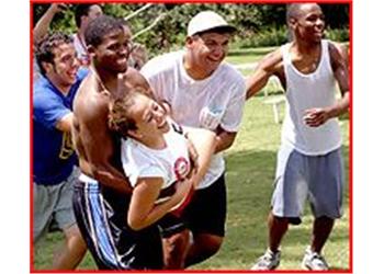 group of people enjoying a piggyback race