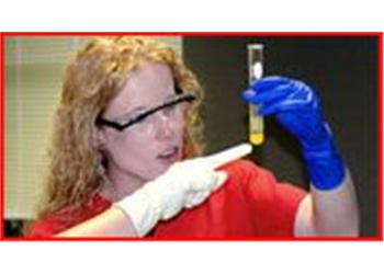 scientist examining a test tube in a lab