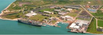 aerial view of coastal campus and ship