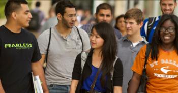 students walking and talking on campus