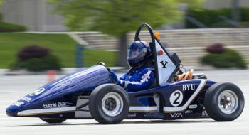 race car with BYU logo on track