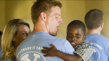 group hug with shirts reading 'Y serve'