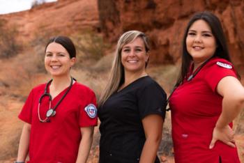 nursing students in red scrubs