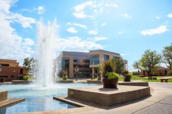 campus fountain with buildings behind