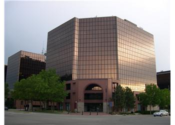 reflection on the glass facade of a modern building