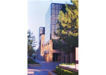 alleyway between modern academic buildings at dusk