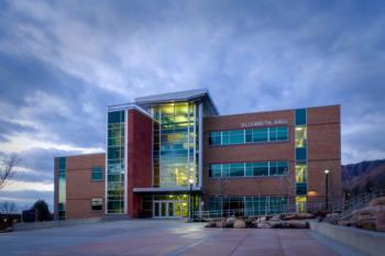 building entrance at twilight with lights on