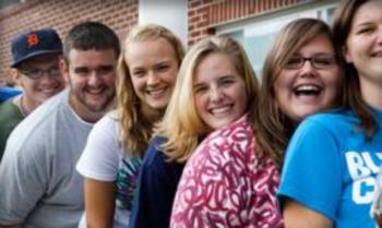 group of students smiling outdoors