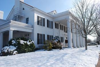 white building with columns covered in snow