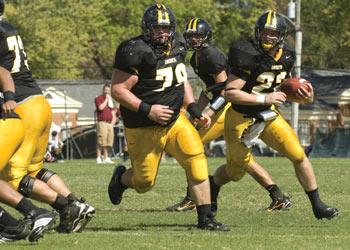 football players running during a game