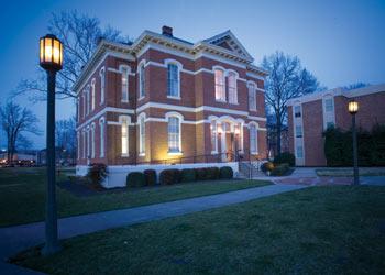 lit brick building at dusk