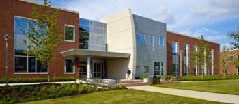 modern campus building with lawn