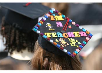 graduation cap with 'i'm a teacher' decoration