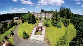 aerial view of a campus building and garden