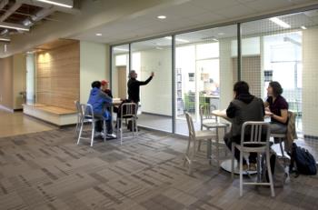 students studying in a brightly-lit indoor area