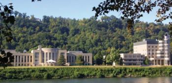 campus buildings across a river