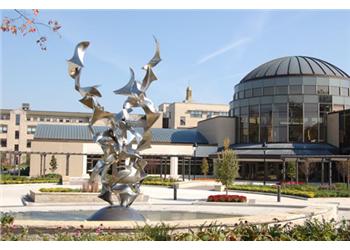 modern sculpture in university courtyard