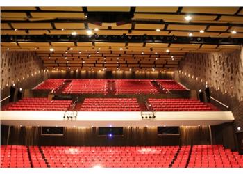 interior of an auditorium with red seats