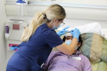 nurse attending to a patient in a simulated setting