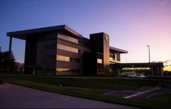 modern building at dusk with purple sky