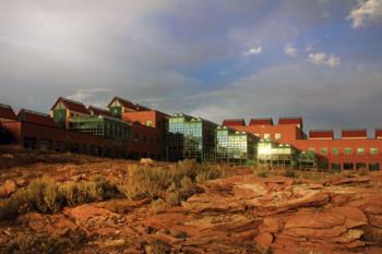 brick buildings with glowing windows at dusk