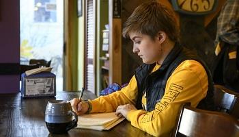 student studying at a cafe